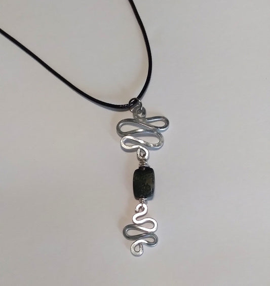 silver aluminum swirl with shades of black centered bead Necklace
